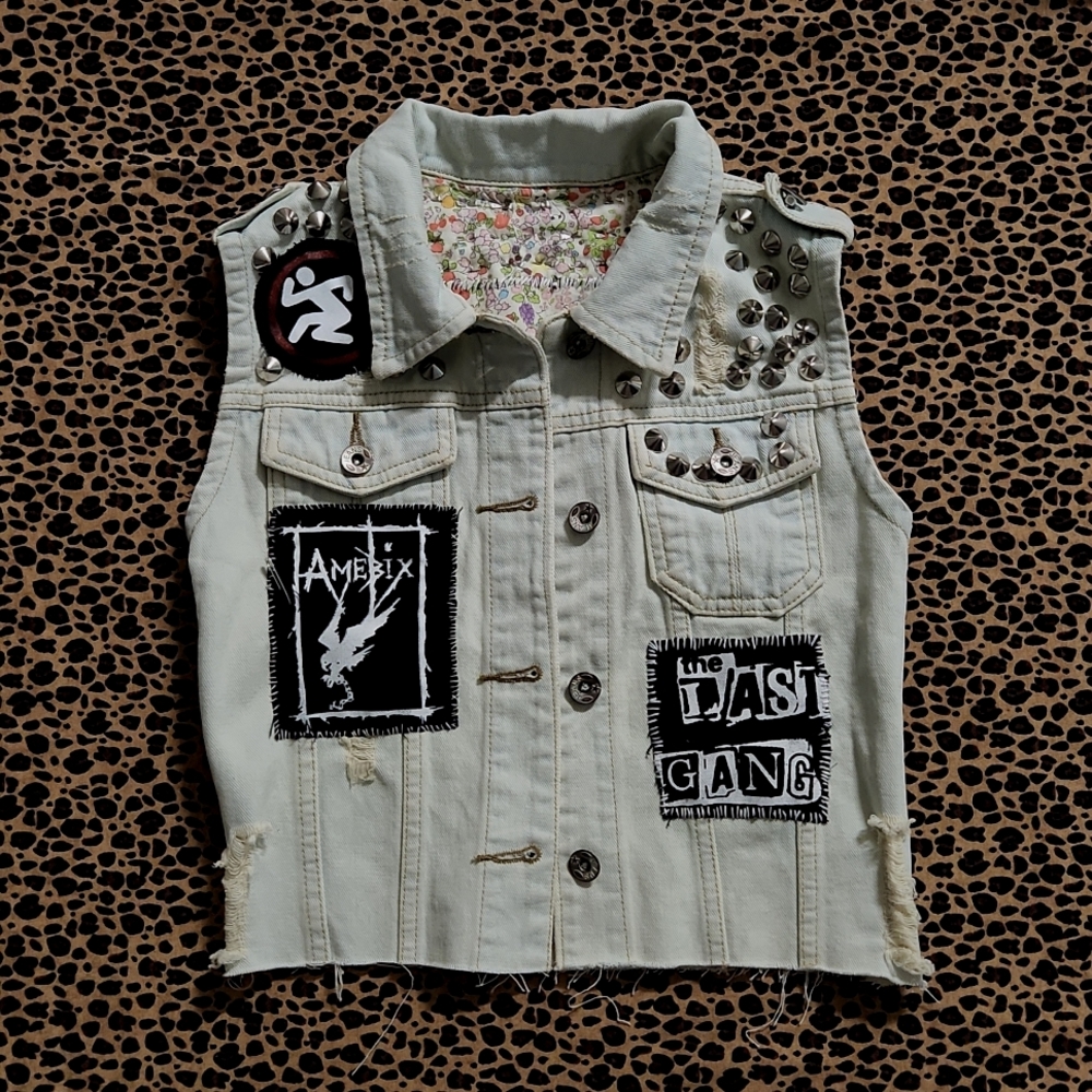 Punk vest with patches and cone stud.